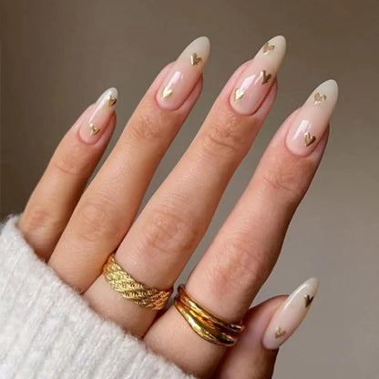Valentines Day Press on Nails Medium Almond Fake Nails Nude False Nails with Golden Heart Designs Nude Glue on Nails Heart Stick on Nails Cute Acrylic Nails Full Cover Glossy Artificial Nails